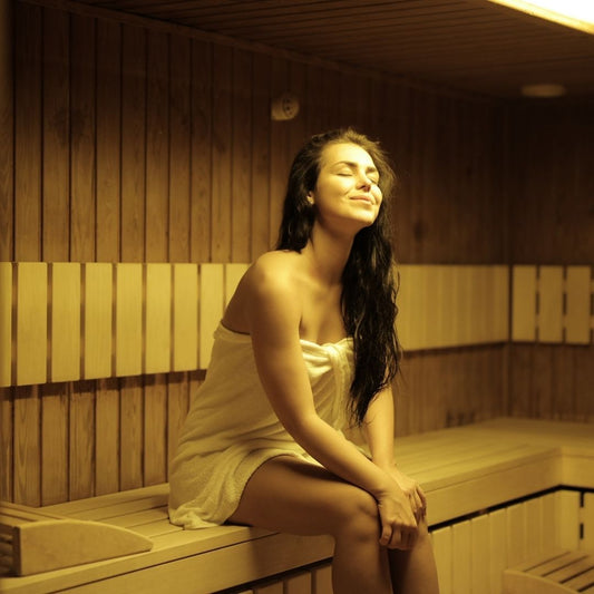 woman-sitting-in-sauna-smiling